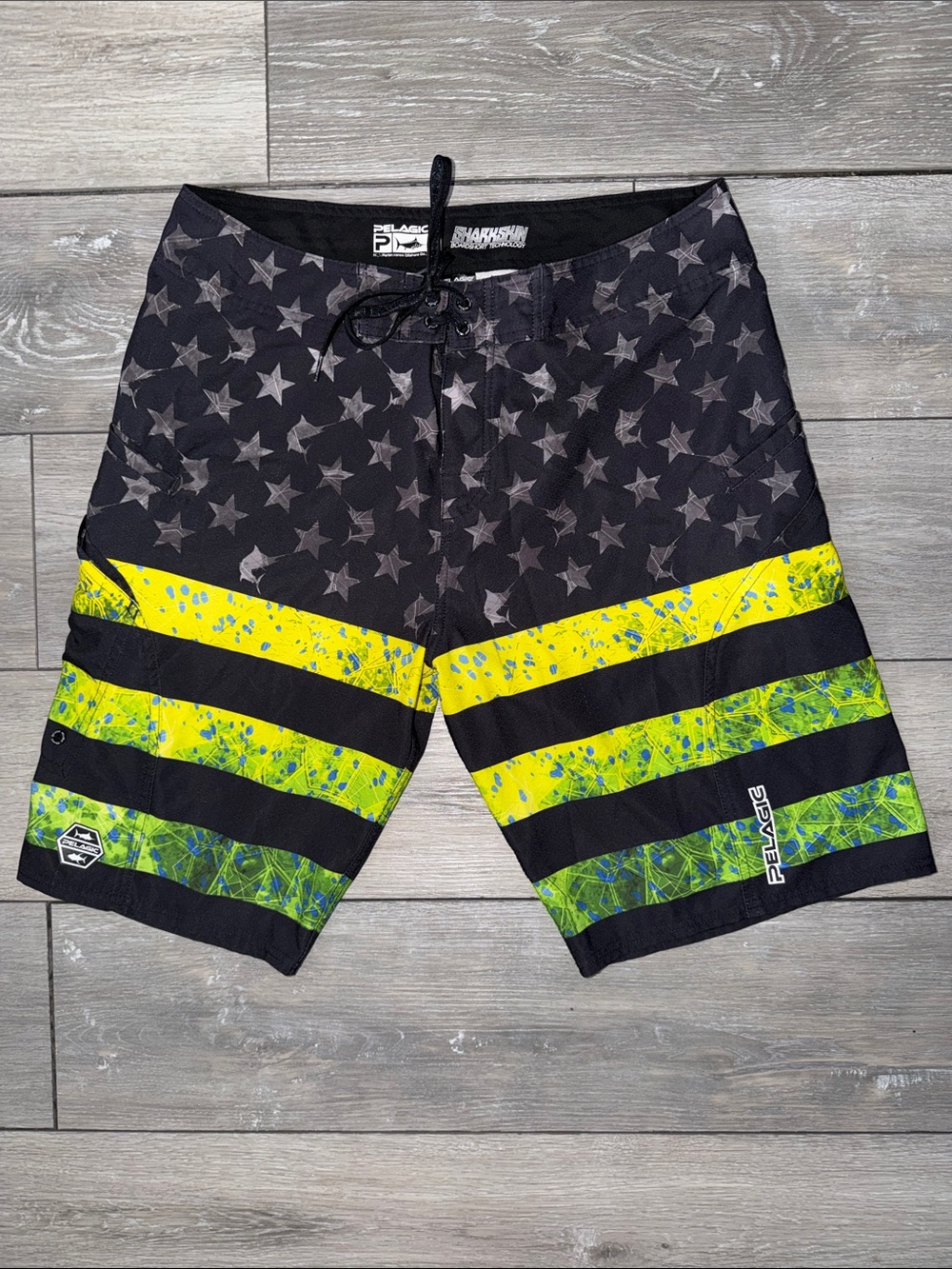 Pelagic Men’s Black with Neon Yellow-Green Star Pattern Board Shorts 34